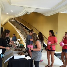 A line forms at the Angel Cakes table